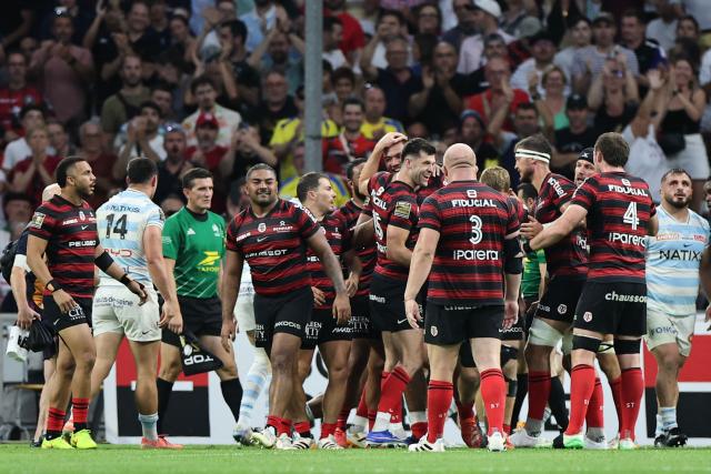Stade Toulousain players celebrate scoring a try during the French Top14 rugby union semi-final match between Stade Toulousain Rugby (Toulouse) and Racing 92 at the Velodrome stadium in Marseille, southern France on June 19, 2026. (Photo by Thibaud MORITZ / AFP)