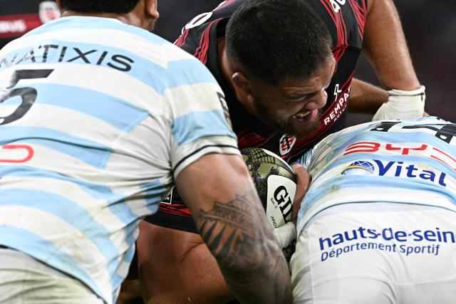 Toulouse's French lock Emmanuel Meafou is tackled during the French Top14 rugby union semi-final match between Stade Toulousain Rugby (Toulouse) and Racing 92 at the Velodrome stadium in Marseille, southern France on June 19, 2026. (Photo by Gabriel BOUYS / AFP)