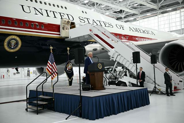 US President Donald Trump speaks in front of the new Air Force One, gifted to him by Qatar, in a hangar at Joint Base Andrews in Maryland on June 19, 2026. White House officials bade farewell on June 18, 2026 to one of the two jets that have been used to transport US presidents for more than 30 years. The goodbye messages fueled speculation that a Boeing 747 controversially gifted to President Donald Trump by the Gulf emirate of Qatar is now due to enter service. Trump will be heading to Joint Base Andrews before spending the weekend at Camp David. (Photo by Brendan SMIALOWSKI / AFP)