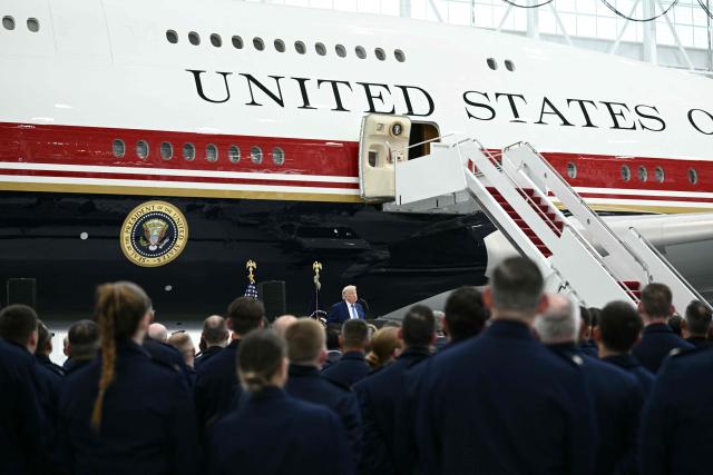 US President Donald Trump speaks in front of the new Air Force One, gifted to him by Qatar, in a hangar at Joint Base Andrews in Maryland on June 19, 2026. White House officials bade farewell on June 18, 2026 to one of the two jets that have been used to transport US presidents for more than 30 years. The goodbye messages fueled speculation that a Boeing 747 controversially gifted to President Donald Trump by the Gulf emirate of Qatar is now due to enter service. Trump will be heading to Joint Base Andrews before spending the weekend at Camp David. (Photo by Brendan SMIALOWSKI / AFP)