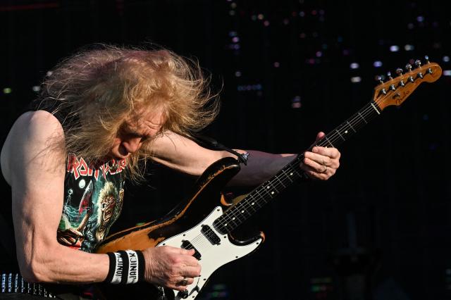 British guitarist Janick Gers from Iron Maiden performs during the 19th edition of Hellfest rock and heavy metal festival, in Clisson, western France, on June 19, 2026. (Photo by Sebastien Salom-Gomis / AFP)
