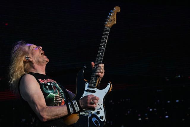 British guitarist Janick Gers from Iron Maiden performs during the 19th edition of Hellfest rock and heavy metal festival, in Clisson, western France, on June 19, 2026. (Photo by Sebastien Salom-Gomis / AFP)