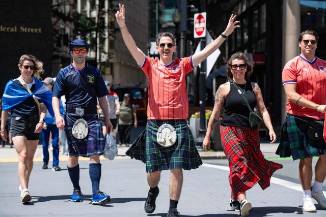Members of the Tartan Army make their way to South Station to board trains to Boston Stadium to watch the upcoming World Cup match between Scotland and Morocco in Boston, Massachusetts, on June 19, 2026. From drinking the bars dry to lustily serenading an iconic baseball stadium with a rendition of "Flower of Scotland", the bagpipe-playing, kilt-wearing hordes of the Tartan Army have captivated Boston since arriving at the World Cup. Scotland's famously good-natured travelling supporters had waited nearly 30 years for the chance to follow their team to a World Cup and the thousands who have made the journey to the tournament are merrily making up for lost time, to the delight of Bostonians. (Photo by JOSEPH PREZIOSO / AFP)