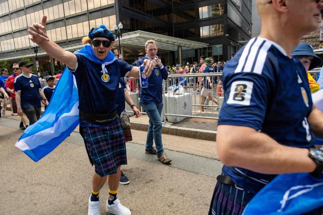 Members of the Tartan Army make their way to South Station to board trains to Boston Stadium to watch the upcoming World Cup match between Scotland and Morocco in Boston, Massachusetts, on June 19, 2026. From drinking the bars dry to lustily serenading an iconic baseball stadium with a rendition of "Flower of Scotland", the bagpipe-playing, kilt-wearing hordes of the Tartan Army have captivated Boston since arriving at the World Cup. Scotland's famously good-natured travelling supporters had waited nearly 30 years for the chance to follow their team to a World Cup and the thousands who have made the journey to the tournament are merrily making up for lost time, to the delight of Bostonians. (Photo by JOSEPH PREZIOSO / AFP)