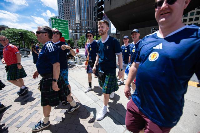 Members of the Tartan Army make their way to South Station to board trains to Boston Stadium to watch the upcoming World Cup match between Scotland and Morocco in Boston, Massachusetts, on June 19, 2026. From drinking the bars dry to lustily serenading an iconic baseball stadium with a rendition of "Flower of Scotland", the bagpipe-playing, kilt-wearing hordes of the Tartan Army have captivated Boston since arriving at the World Cup. Scotland's famously good-natured travelling supporters had waited nearly 30 years for the chance to follow their team to a World Cup and the thousands who have made the journey to the tournament are merrily making up for lost time, to the delight of Bostonians. (Photo by JOSEPH PREZIOSO / AFP)