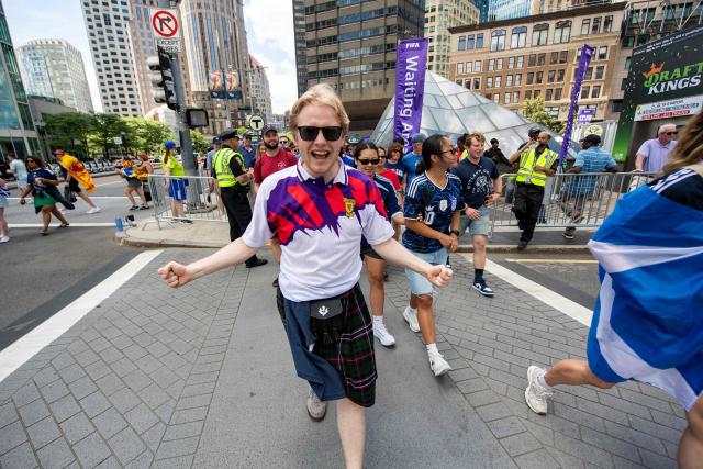 Members of the Tartan Army make their way to South Station to board trains to Boston Stadium to watch the upcoming World Cup match between Scotland and Morocco in Boston, Massachusetts, on June 19, 2026. From drinking the bars dry to lustily serenading an iconic baseball stadium with a rendition of "Flower of Scotland", the bagpipe-playing, kilt-wearing hordes of the Tartan Army have captivated Boston since arriving at the World Cup. Scotland's famously good-natured travelling supporters had waited nearly 30 years for the chance to follow their team to a World Cup and the thousands who have made the journey to the tournament are merrily making up for lost time, to the delight of Bostonians. (Photo by JOSEPH PREZIOSO / AFP)