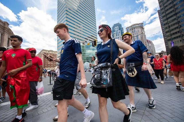 Members of the Tartan Army make their way to South Station to board trains to Boston Stadium to watch the upcoming World Cup match between Scotland and Morocco in Boston, Massachusetts, on June 19, 2026. From drinking the bars dry to lustily serenading an iconic baseball stadium with a rendition of "Flower of Scotland", the bagpipe-playing, kilt-wearing hordes of the Tartan Army have captivated Boston since arriving at the World Cup. Scotland's famously good-natured travelling supporters had waited nearly 30 years for the chance to follow their team to a World Cup and the thousands who have made the journey to the tournament are merrily making up for lost time, to the delight of Bostonians. (Photo by JOSEPH PREZIOSO / AFP)