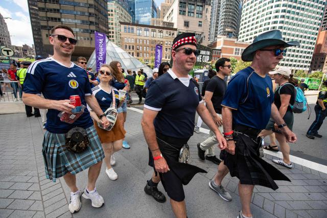 Members of the Tartan Army make their way to South Station to board trains to Boston Stadium to watch the upcoming World Cup match between Scotland and Morocco in Boston, Massachusetts, on June 19, 2026. From drinking the bars dry to lustily serenading an iconic baseball stadium with a rendition of "Flower of Scotland", the bagpipe-playing, kilt-wearing hordes of the Tartan Army have captivated Boston since arriving at the World Cup. Scotland's famously good-natured travelling supporters had waited nearly 30 years for the chance to follow their team to a World Cup and the thousands who have made the journey to the tournament are merrily making up for lost time, to the delight of Bostonians. (Photo by JOSEPH PREZIOSO / AFP)