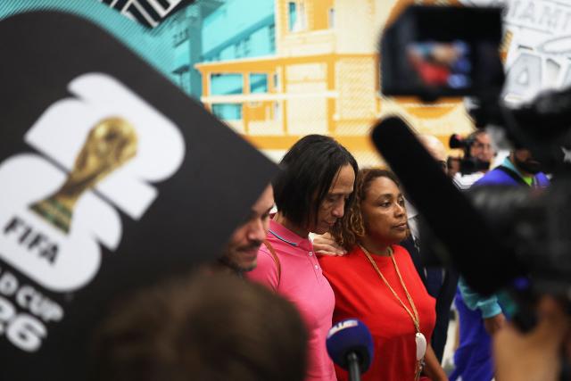 Ana Candida Evora (C), the mother Cape Verde's goalkeeper Vozinha, reacts upon arrival at Miami International Airport on June 19, 2026, during the 2026 World Cup football tournament. Vozinha's mother, who was unable to enter the United States over visa price issues, arrived to the country to attend the upcoming matches of Cape Verde. (Photo by PATRICIA DE MELO MOREIRA / AFP)