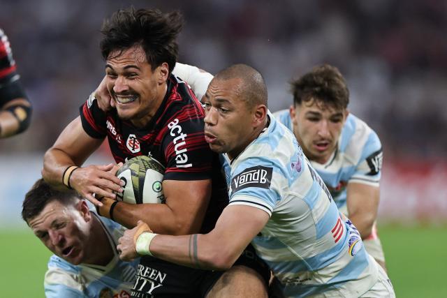 Toulouse's French centre Kalvin Gourgues is tackled during the French Top14 rugby union semi-final match between Stade Toulousain Rugby (Toulouse) and Racing 92 at the Velodrome stadium in Marseille, southern France on June 19, 2026. (Photo by Thibaud MORITZ / AFP)