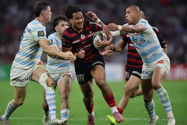 Toulouse's French centre Kalvin Gourgues is tackled during the French Top14 rugby union semi-final match between Stade Toulousain Rugby (Toulouse) and Racing 92 at the Velodrome stadium in Marseille, southern France on June 19, 2026. (Photo by Thibaud MORITZ / AFP)
