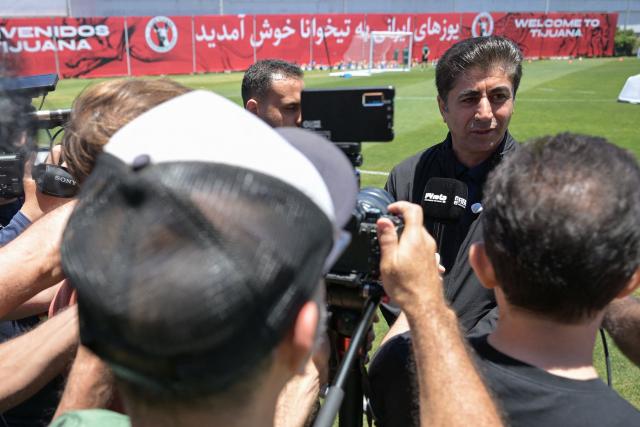 Iran's defender #03 Ehsan Hajsafi (L) and teammates takes part in a training session ahead of Iran's FIFA World Cup 2026 Group G football match against Belgium at Centro Xoloitzcuintle in Tijuana on June 19, 2026. (Photo by Guillermo Arias / AFP)
