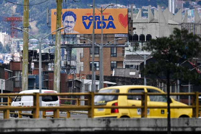 A campaign billboard of Colombia's presidential candidate Ivan Cepeda of the Pacto Historico party is seen in Bogota on June 19, 2026. Colombians vote on June 21, 2026 in a presidential runoff pitting a hard-right opera-singer-turned-lawyer against a leftist senator, an election with stark consequences for the country's stumbling peace process with armed groups and strained ties with Washington. (Photo by Juan BARRETO / AFP)