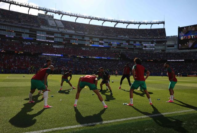 Morocco's players warm up ahead of the 2026 World Cup Group C football match between Scotland and Morocco at the Boston Stadium in Foxborough on June 19, 2026.  (Photo by FRANCK FIFE / AFP)