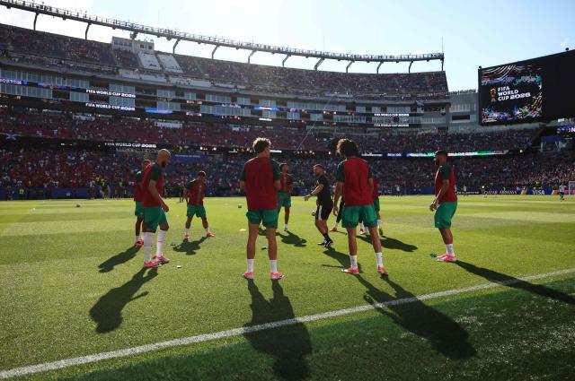 Morocco's players warm up ahead of the 2026 World Cup Group C football match between Scotland and Morocco at the Boston Stadium in Foxborough on June 19, 2026.  (Photo by FRANCK FIFE / AFP)