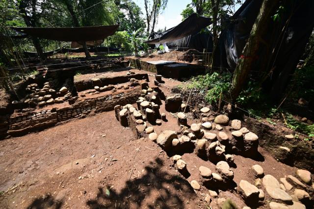 View of an archaeological site in Coatepec, Veracruz, Mexico, on June 18, 2026. Mexican archaeologists have discovered the remains of a structure and a sculpture bearing features similar to those of the Maya culture and other characteristics described as “never before seen” in the eastern state of Veracruz. (Photo by Marco Antonio MARTINEZ / AFP)