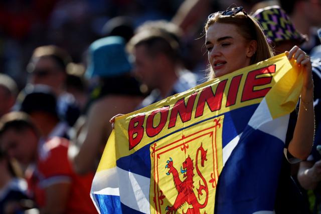A Scottish fan cheers for her team ahead of the 2026 World Cup Group C football match between Scotland and Morocco at the Boston Stadium in Foxborough on June 19, 2026.  (Photo by FRANCK FIFE / AFP)