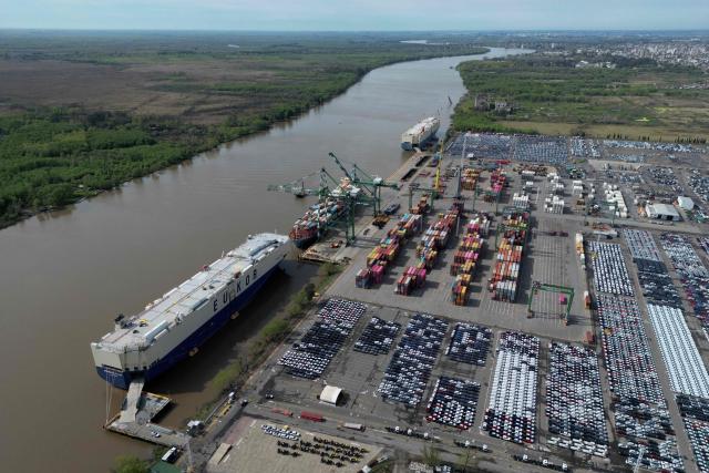 (FILES) Aerial view of Zarate port on the banks of the Parana river, in Zarate, Buenos Aires province, taken on September 18, 2025. The Argentine government confirmed on June 19, 2026 that the consortium comprising the Belgian company Jan De Nul and the local firm Servimagnus will hold a 25-year concession for the dredging and marking of the Parana-Paraguay waterway, through which 80 per cent of the country's exports are transported. (Photo by Luis ROBAYO / AFP)