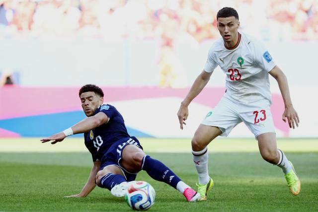 Scotland's forward #10 Che Adams and Morocco's defender #13 Zakaria El Ouahdi fight for the ball during the 2026 World Cup Group C football match between Scotland and Morocco at the Boston Stadium in Foxborough on June 19, 2026.  (Photo by FRANCK FIFE / AFP)