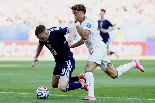 Scotland's midfielder #19 Lewis Ferguson is fouled by Morocco's midfielder #24 Neil El Aynaoui during the 2026 World Cup Group C football match between Scotland and Morocco at the Boston Stadium in Foxborough on June 19, 2026.  (Photo by FRANCK FIFE / AFP)