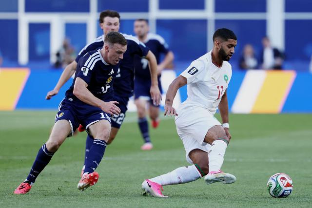 Scotland's midfielder #19 Lewis Ferguson and Morocco's midfielder #11 Ismael Saibari fight for the ball during the 2026 World Cup Group C football match between Scotland and Morocco at the Boston Stadium in Foxborough on June 19, 2026.  (Photo by FRANCK FIFE / AFP)