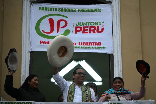 Peru's presidential candidate for the Juntos por el Peru party, Roberto Sanchez, greets supporters during a protest in Lima on June 19, 2026. Peru's neck-and-neck presidential election pitting conservative Keiko Fujimori against leftist Roberto Sanchez is one of the tightest leadership contests Latin America has seen in decades, an AFP analysis showed. (Photo by ERNESTO BENAVIDES / AFP)