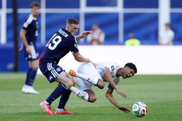 Scotland's midfielder #19 Lewis Ferguson and Morocco's defender #02 Achraf Hakimi fight for the ball during the 2026 World Cup Group C football match between Scotland and Morocco at the Boston Stadium in Foxborough on June 19, 2026.  (Photo by FRANCK FIFE / AFP)