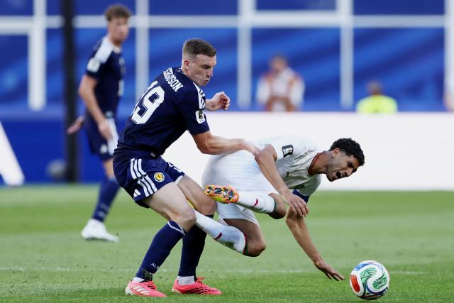 Morocco's defender #02 Achraf Hakimi is fouled by Scotland's midfielder #19 Lewis Ferguson during the 2026 World Cup Group C football match between Scotland and Morocco at the Boston Stadium in Foxborough on June 19, 2026.  (Photo by FRANCK FIFE / AFP)