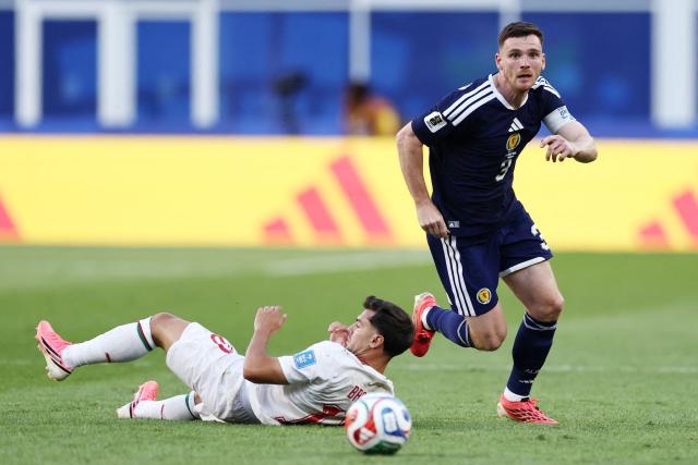 Morocco's forward #10 Brahim Diaz falls next to Scotland's defender #03 Andrew Robertson during the 2026 World Cup Group C football match between Scotland and Morocco at the Boston Stadium in Foxborough on June 19, 2026.  (Photo by FRANCK FIFE / AFP)