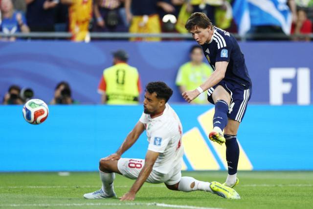 Scotland's midfielder #04 Scott McTominay shoots past Morocco's defender #18 Chadi Riad during the 2026 World Cup Group C football match between Scotland and Morocco at the Boston Stadium in Foxborough on June 19, 2026.  (Photo by FRANCK FIFE / AFP)