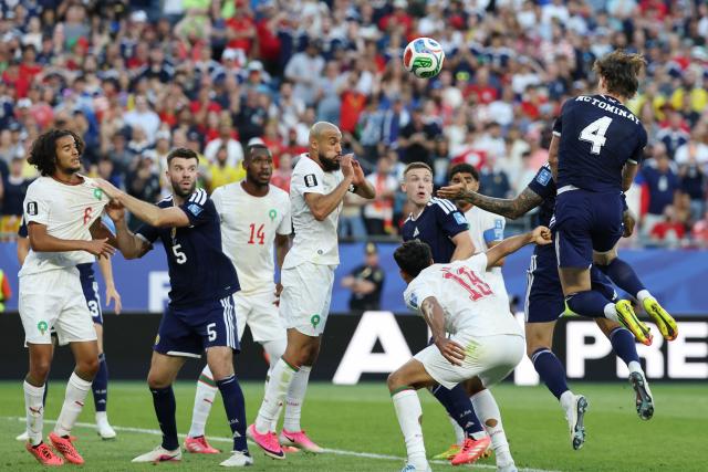 Scotland's midfielder #04 Scott McTominay jumps to head the ball during the 2026 World Cup Group C football match between Scotland and Morocco at the Boston Stadium in Foxborough on June 19, 2026.  (Photo by FRANCK FIFE / AFP)