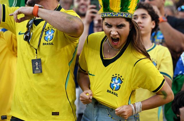 A Brazilian fan shows the Brazil's badge on her shirt ahead of the 2026 World Cup Group C football match between Brazil and Haiti at the Philadelphia Stadium in Philadelphia on June 19, 2026.  (Photo by ROBERTO SCHMIDT / AFP)