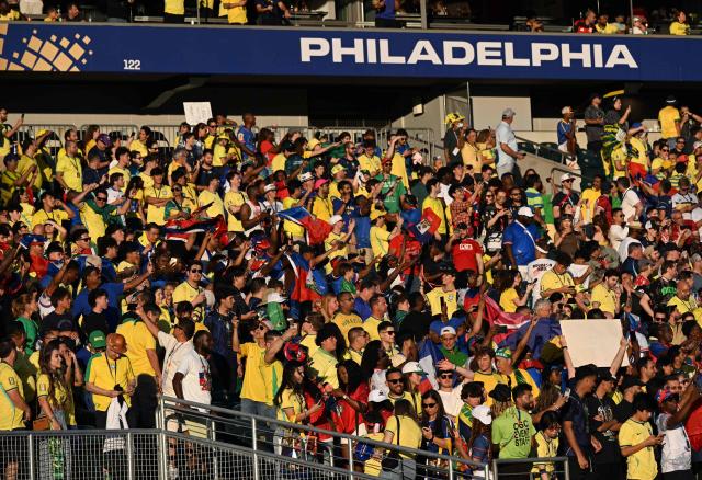 Brazilian and Haitian fans cheer for their teams ahead of the 2026 World Cup Group C football match between Brazil and Haiti at the Philadelphia Stadium in Philadelphia on June 19, 2026.  (Photo by ROBERTO SCHMIDT / AFP)