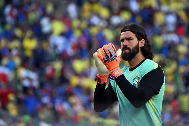 Brazil's goalkeeper #01 Alisson warms up ahead of the 2026 World Cup Group C football match between Brazil and Haiti at the Philadelphia Stadium in Philadelphia on June 19, 2026.  (Photo by Mauro PIMENTEL / AFP)