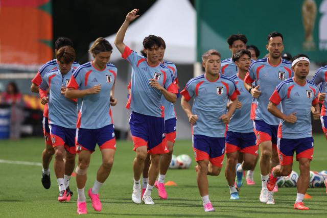 Japan's defender #22 Takehiro Tomiyasu (C) and teammates take part in an MD-1 training session at the Rayados Training Centre in Santiago, near Monterrey, Mexico on June 19, 2026, on the eve of the 2026 World Cup Group F football match between Tunisia and Japan.  (Photo by Julio Cesar AGUILAR / AFP)