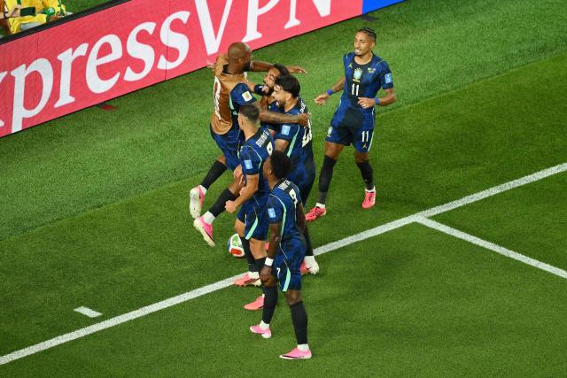 Brazil’s players celebrate after forward #09 Matheus Cunha (2nd L) scores his team’s first goal during the 2026 World Cup Group C football match between Brazil and Haiti at the Philadelphia Stadium in Philadelphia on June 19, 2026.  (Photo by Angela WEISS / AFP)