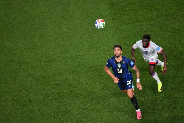 Brazil's midfielder #20 Lucas Paqueta and Haiti's defender #02 Carlens Arcus fight for the ball during the 2026 World Cup Group C football match between Brazil and Haiti at the Philadelphia Stadium in Philadelphia on June 19, 2026.  (Photo by Angela WEISS / AFP)