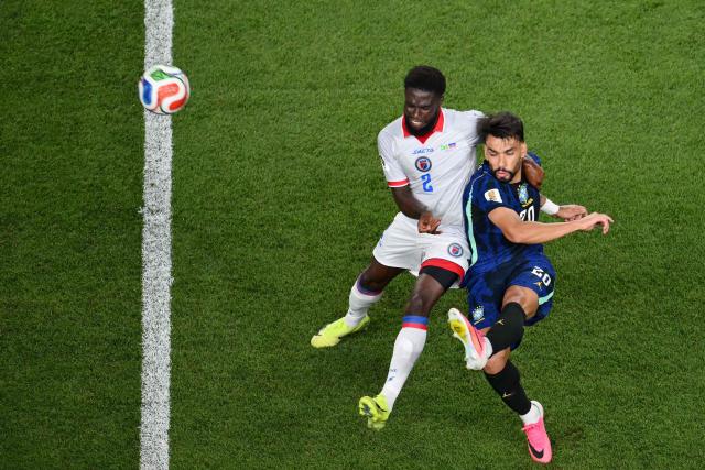 Haiti's defender #02 Carlens Arcus and Brazil's midfielder #20 Lucas Paqueta fight for the ball during the 2026 World Cup Group C football match between Brazil and Haiti at the Philadelphia Stadium in Philadelphia on June 19, 2026.  (Photo by Angela WEISS / AFP)