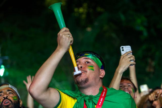 Brazil fans cheer during the FIFA World Cup football match between Brazil and Haiti at Arena Brasileira in Ibirapuera Park, Sao Paulo, Brazil, on June 19, 2026. (Photo by Miguel SCHINCARIOL / AFP)