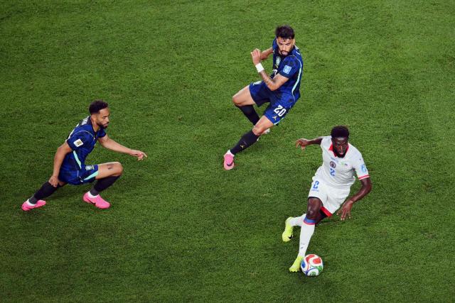 Brazil's midfielder #20 Lucas Paqueta and Haiti's defender #02 Carlens Arcus fight for the ball during the 2026 World Cup Group C football match between Brazil and Haiti at the Philadelphia Stadium in Philadelphia on June 19, 2026.  (Photo by Angela WEISS / AFP)
