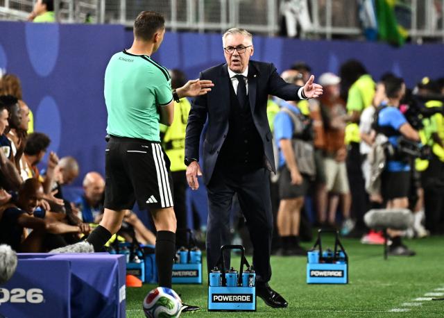 Brazil's Italian head coach Carlo Ancelotti speaks to Swiss referee Sandro Scharer during the 2026 World Cup Group C football match between Brazil and Haiti at the Philadelphia Stadium in Philadelphia on June 19, 2026.  (Photo by Jewel SAMAD / AFP)