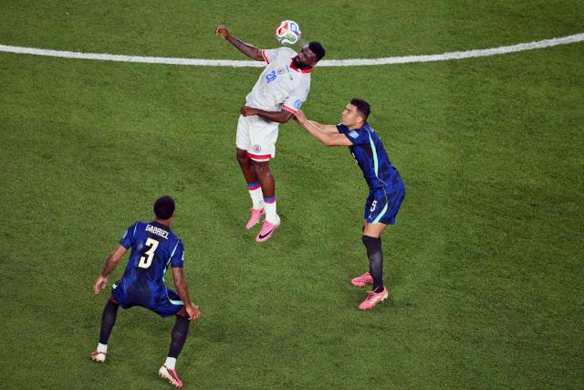 Haiti's forward #20 Frantzdy Pierrot and Brazil's midfielder #05 Casemiro fight for the ball during the 2026 World Cup Group C football match between Brazil and Haiti at the Philadelphia Stadium in Philadelphia on June 19, 2026.  (Photo by Angela WEISS / AFP)