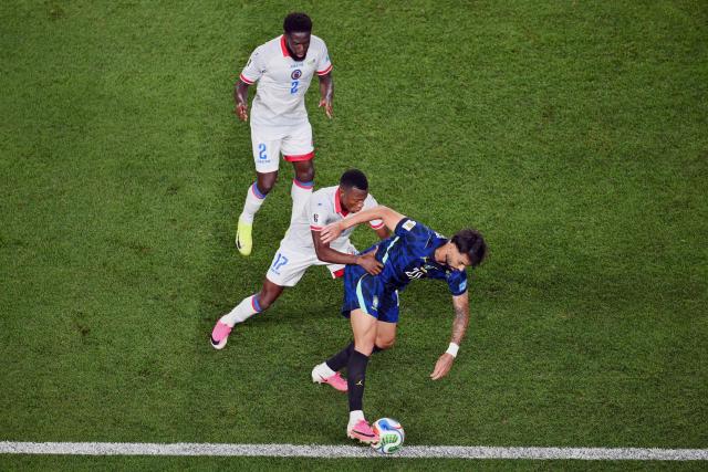 Haiti's midfielder #17 Danley Jean Jacques (C) and Brazil's midfielder #20 Lucas Paqueta (R) fight for the ball during the 2026 World Cup Group C football match between Brazil and Haiti at the Philadelphia Stadium in Philadelphia on June 19, 2026.  (Photo by Angela WEISS / AFP)