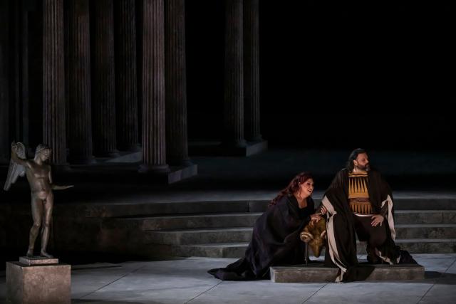 Italian soprano Anna Pirozzi (L) and French solist and tenor Jean-Francois Borras perform in the opera 'Medea' at the Ancient Greek theatre of former city Epidaurus, in Nea Epidavros on June 18, 2026. With flamboyant costumes reminiscent of those from 1961, and a production reconstructed using notebooks and photographs from the period: 'Medea', the opera that brought Maria Callas her triumph, is being revived at the ancient Greek theatre of Epidaurus. During a one-off, sold-out performance on Saturday evening, the Greek National Opera returns for the first time in 65 years to this 4th-century BC amphitheatre, 200 kilometres from Athens, renowned for its exceptional acoustics. (Photo by Aris MESSINIS / AFP)
