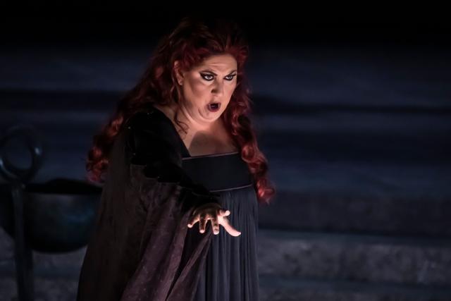 Italian soprano Anna Pirozzi performs in the opera 'Medea' at the Ancient Greek theatre of former city Epidaurus, in Nea Epidavros on June 18, 2026. With flamboyant costumes reminiscent of those from 1961, and a production reconstructed using notebooks and photographs from the period: 'Medea', the opera that brought Maria Callas her triumph, is being revived at the ancient Greek theatre of Epidaurus. During a one-off, sold-out performance on Saturday evening, the Greek National Opera returns for the first time in 65 years to this 4th-century BC amphitheatre, 200 kilometres from Athens, renowned for its exceptional acoustics. (Photo by Aris MESSINIS / AFP)