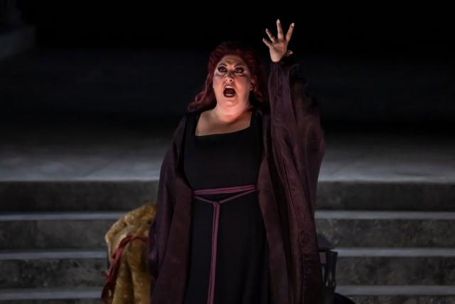 Italian soprano Anna Pirozzi performs in the opera 'Medea' at the Ancient Greek theatre of former city Epidaurus, in Nea Epidavros on June 18, 2026. With flamboyant costumes reminiscent of those from 1961, and a production reconstructed using notebooks and photographs from the period: 'Medea', the opera that brought Maria Callas her triumph, is being revived at the ancient Greek theatre of Epidaurus. During a one-off, sold-out performance on Saturday evening, the Greek National Opera returns for the first time in 65 years to this 4th-century BC amphitheatre, 200 kilometres from Athens, renowned for its exceptional acoustics. (Photo by Aris MESSINIS / AFP)