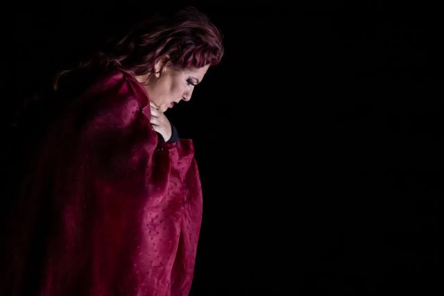 Italian soprano Anna Pirozzi performs in the opera 'Medea' at the Ancient Greek theatre of former city Epidaurus, in Nea Epidavros on June 18, 2026. With flamboyant costumes reminiscent of those from 1961, and a production reconstructed using notebooks and photographs from the period: 'Medea', the opera that brought Maria Callas her triumph, is being revived at the ancient Greek theatre of Epidaurus. During a one-off, sold-out performance on Saturday evening, the Greek National Opera returns for the first time in 65 years to this 4th-century BC amphitheatre, 200 kilometres from Athens, renowned for its exceptional acoustics. (Photo by Aris MESSINIS / AFP)