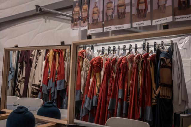 This photograph shows costumes displayed backstage for the opera 'Medea' at the Ancient Greek theatre of former city Epidaurus, in Nea Epidavros on June 18, 2026. With flamboyant costumes reminiscent of those from 1961, and a production reconstructed using notebooks and photographs from the period: 'Medea', the opera that brought Maria Callas her triumph, is being revived at the ancient Greek theatre of Epidaurus. During a one-off, sold-out performance on Saturday evening, the Greek National Opera returns for the first time in 65 years to this 4th-century BC amphitheatre, 200 kilometres from Athens, renowned for its exceptional acoustics. (Photo by Aris MESSINIS / AFP)