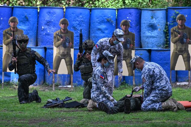 Philippine and South Korean troops alongwith Philippine Coast Guard personnel participate in an amphibious raid military exercise at the marines training base in Ternate, Cavite province, west of Manila on June 20, 2026, as part of the annual Philippines-US joint marines exercise dubbed Kamandag (Venom). (Photo by Jam STA ROSA / AFP)