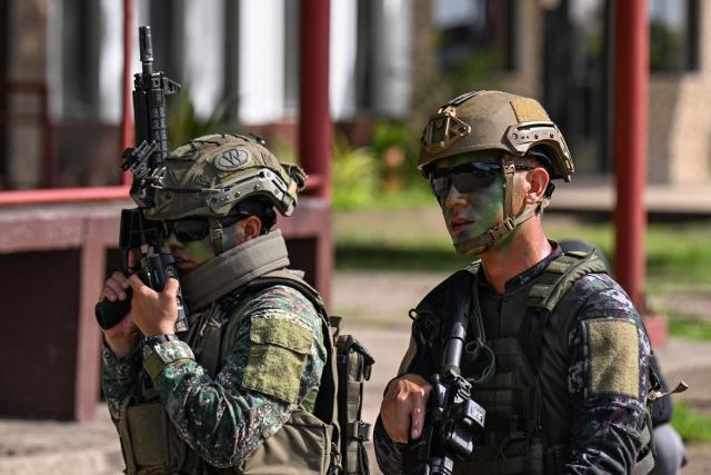 Philippine and South Korean troops participate in an amphibious raid military exercise at the marines training base in Ternate, Cavite province, west of Manila on June 20, 2026, as part of the annual Philippines-US joint marines exercise dubbed Kamandag (Venom). (Photo by Jam STA ROSA / AFP)